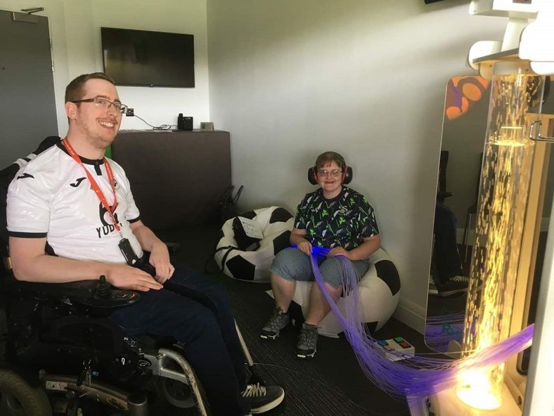 Swansea City fans enjoying the new sensory room at the Liberty Stadium