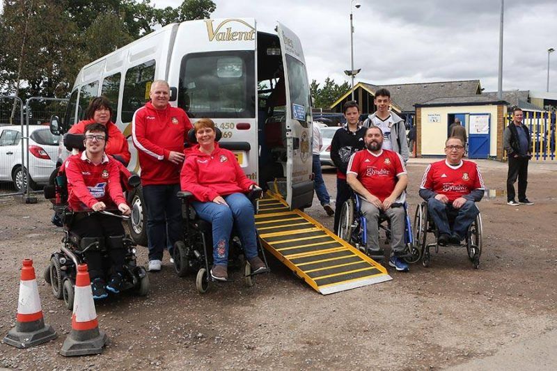 Kerry Evans helps to introduce accesible travel for Wrexhams disabled away supporters.