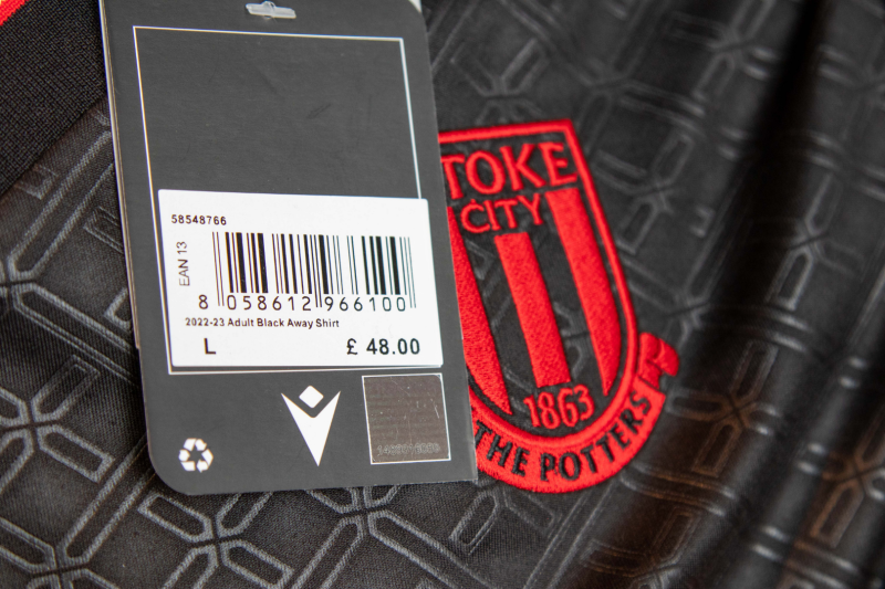 The image shows a label of one of the new Stoke City shirts. The label read 'Adult Black Away Shirt'.